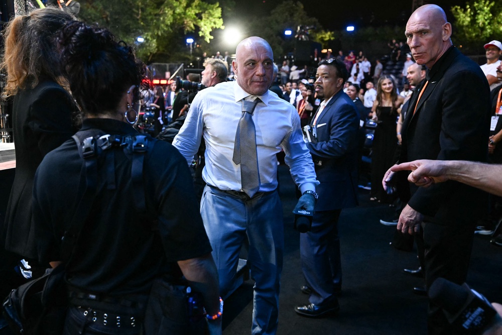 Rogan endorsed Trump in the 2024 election, but since then has criticized several of his major policy initiatives, including his immigration crackdown. Pictured here, the comedian attends Trump's UFC Freedom 250 event at the White House on June 15 (AFP/Getty)