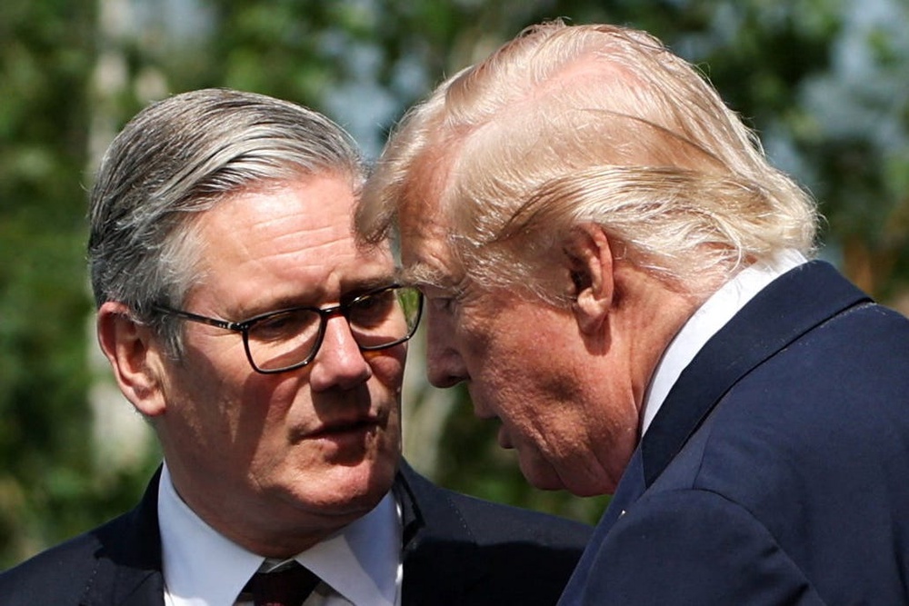 Prime Minister Sir Keir Starmer (left) and U.S. President Donald Trump talk ahead of a family photo during the G7 summit in Evian, France (PA Wire)