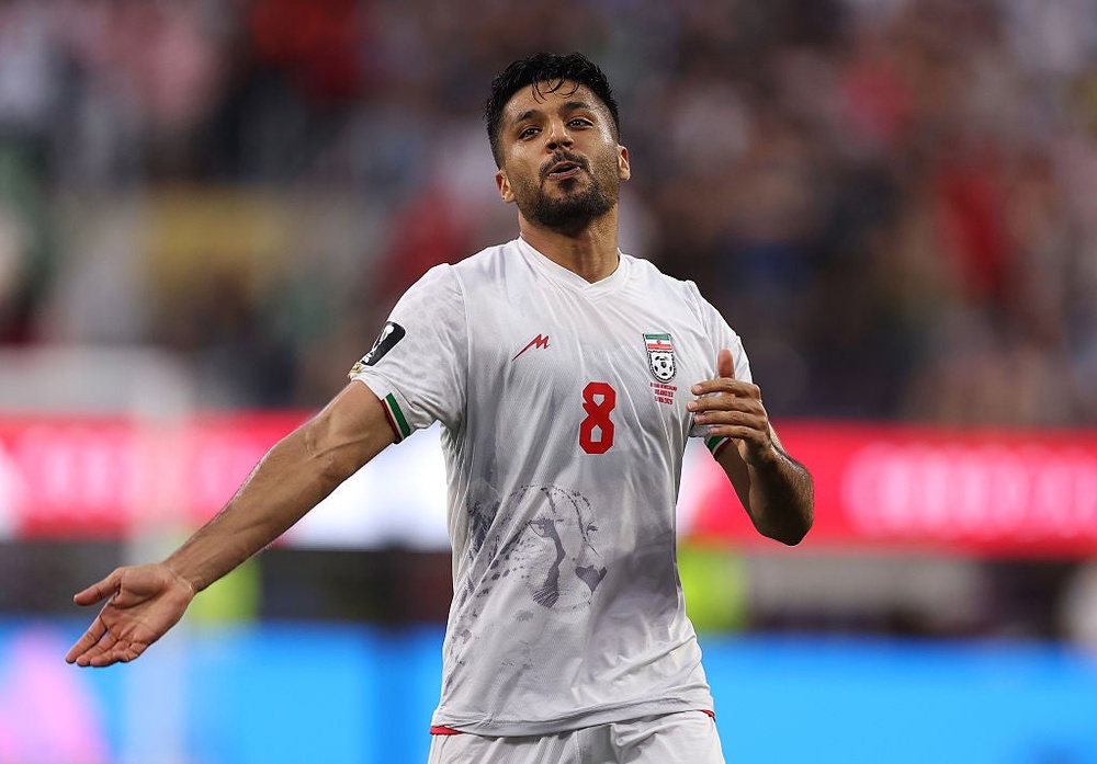The most striking imagery on Iran's home (white) and away (red) kits is an Asiatic cheetah low across the front (Getty Images)