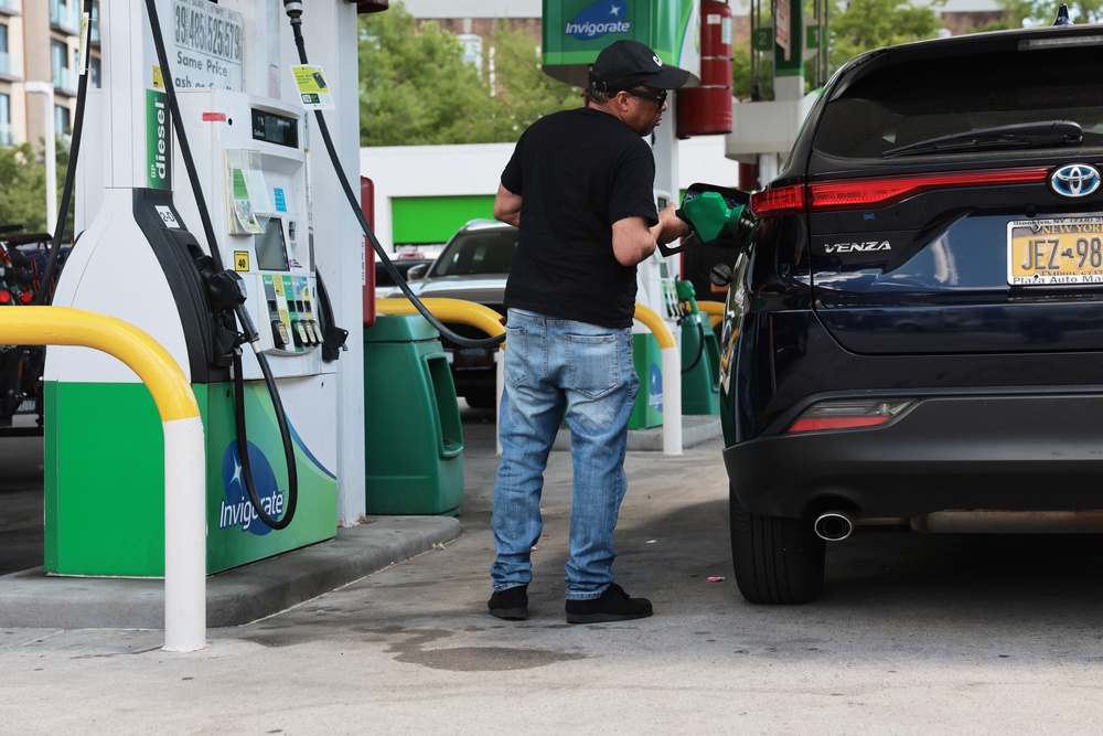On Thursday, the national average price for a gallon of gasoline stood at $3.99, according to AAA. Pictured here, a man fills up his vehicle at a gas station in New York City on June 1 (Getty Images)