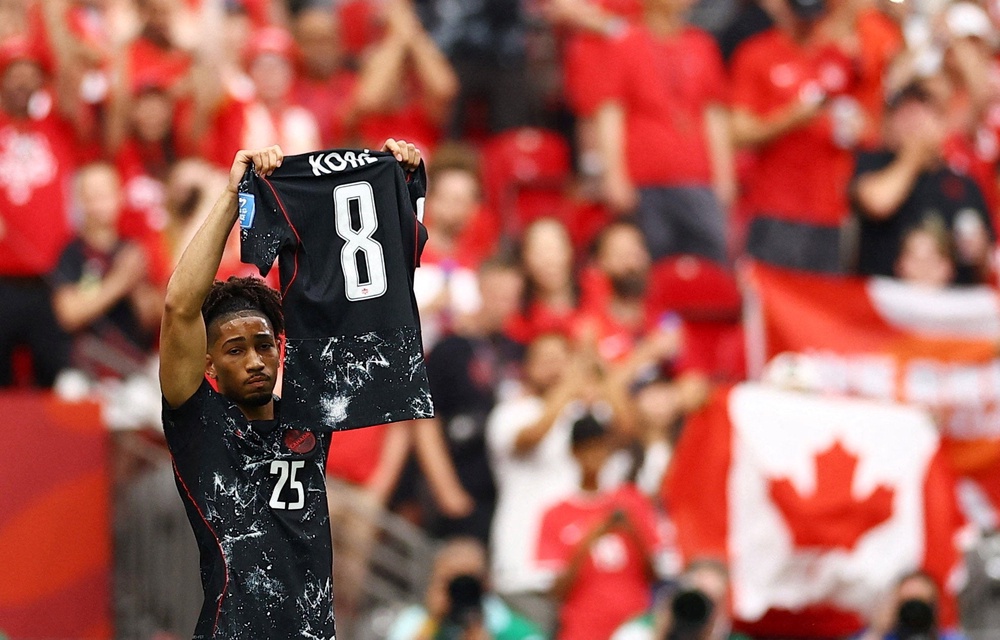 Nathan Saliba raises Ismael Kone's shirt aloft (Reuters)
