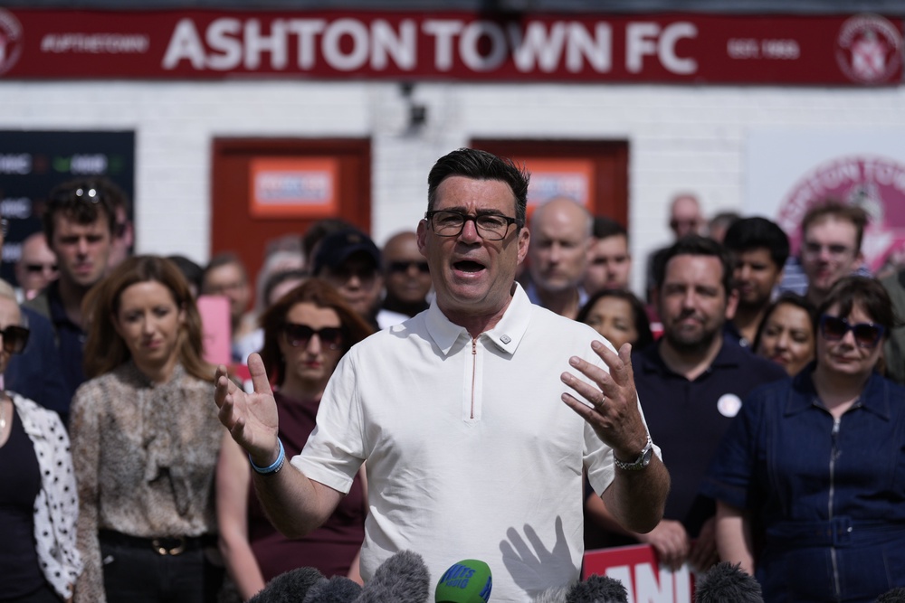 Andy Burnham addressing his supporters at Ashton Town FC (PA)