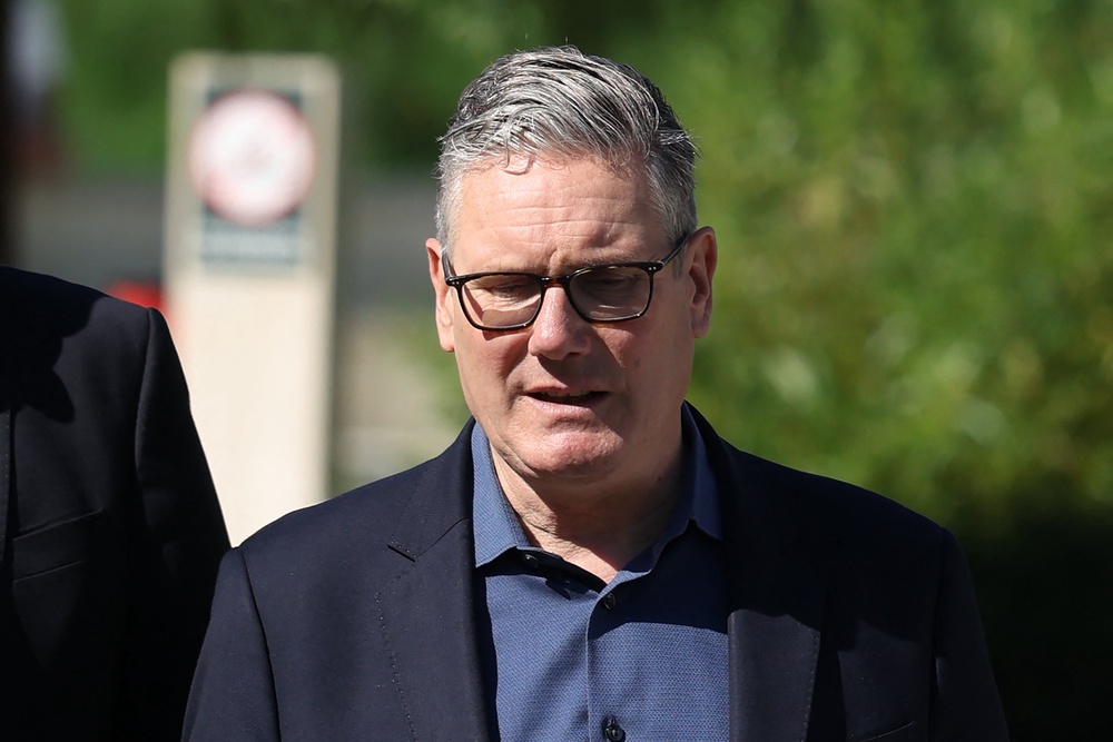 Sir Keir Starmer arrives to visit a housing development in north-west London (AFP/Getty)