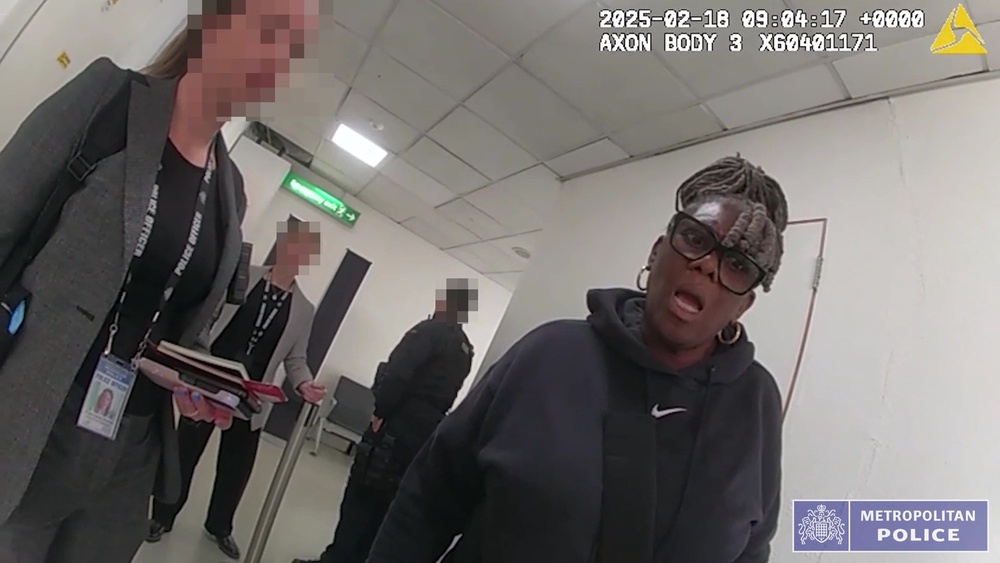 Janice Nix being arrested at Heathrow Airport, London. (Metropolitan Police)