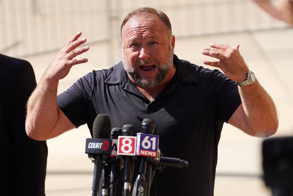 InfoWars, formerly the right-wing website of conspiracy theorist Alex Jones, has been in limbo since he was sued for defamation for baselessly claiming the 2012 mass shooting in Newtown, Connecticut, was a hoax (Getty Images)