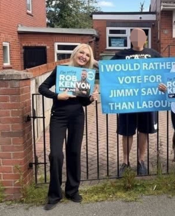 Lilian Rogers, left, said she was sorry for posing with the sign (Social media)