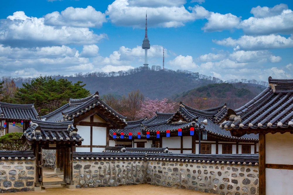 Old meets new: Namsangol Hanok Village and the Seoul Tower in the background (Getty/iStock)