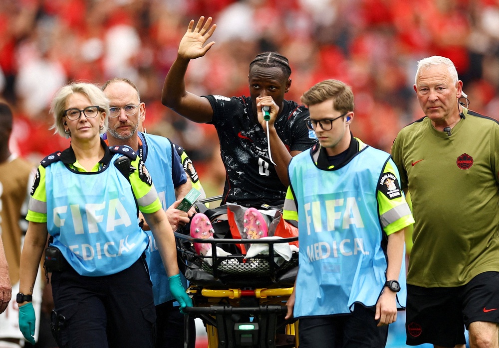 Ismael Singo was stretchered off after breaking his leg (Reuters)