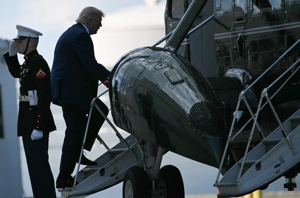 US president Donald Trump boards Marine One at Joint Base Andrews in Maryland as he heads to Camp David for the weekend (AFP/Getty)