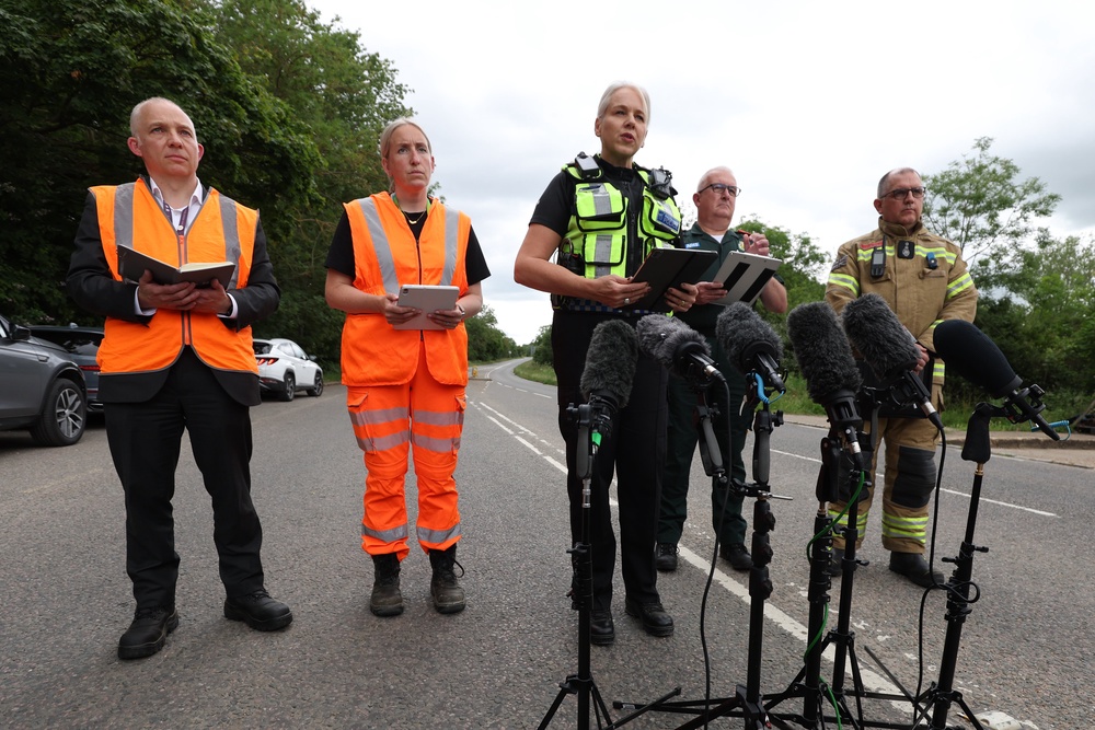 British Transport Police Chief Constable Lucy D'Orsi (centre) spoke to members of the media near the scene on Saturday afternoon (PA)
