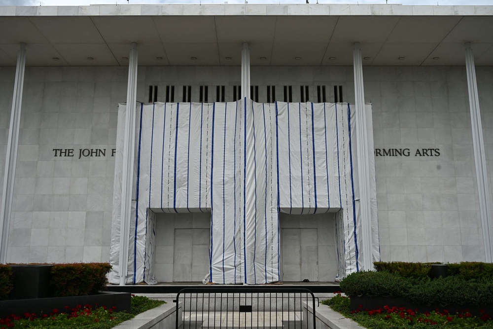 In May, a judge ordered that Trump’s name be removed from the building’s facade. The lettering has since been taken down, but a large tarp remains in place where it once appeared blocking the public’s view of signage (AFP via Getty Images)