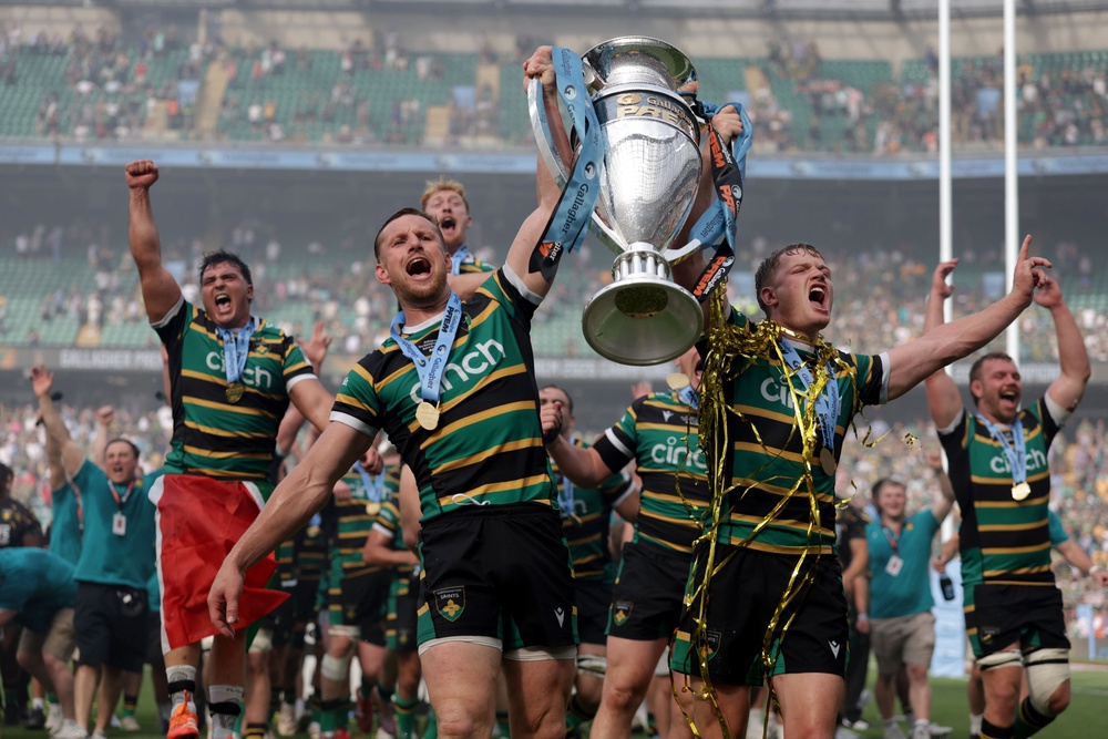 Northampton Saints players celebrate with the Prem trophy (PA Wire)