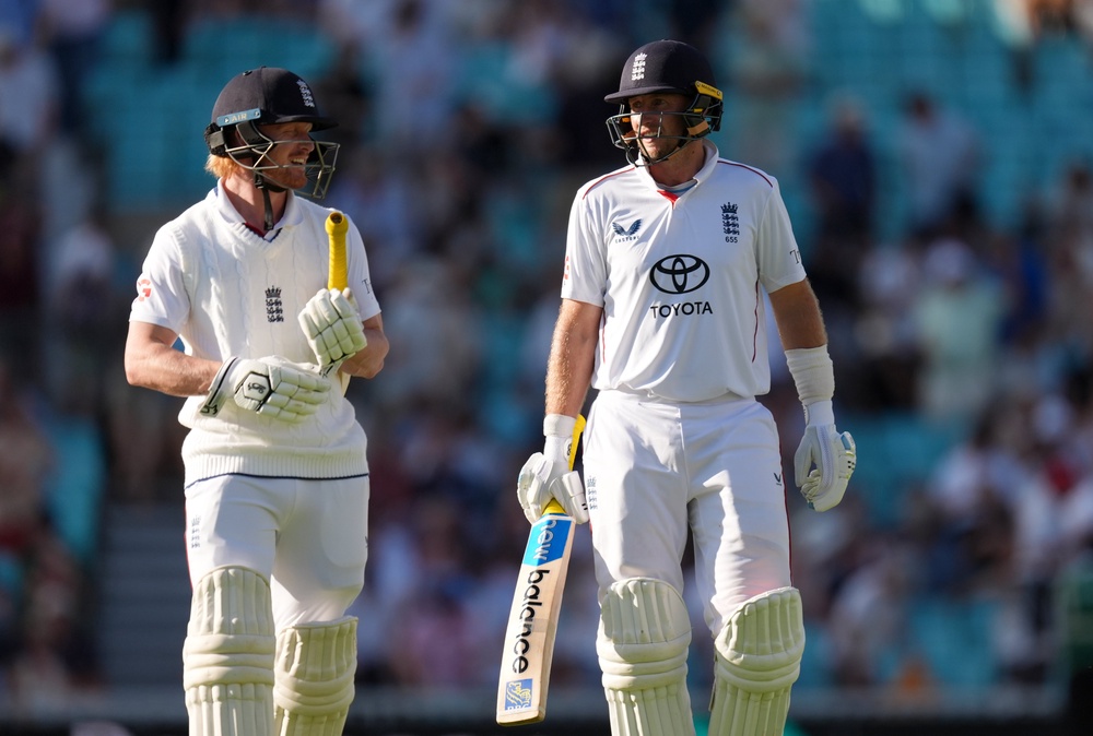 England’s Jordan Cox, left, and Joe Root leave the field at the close of play (Ben Whitley/PA) (PA Wire)