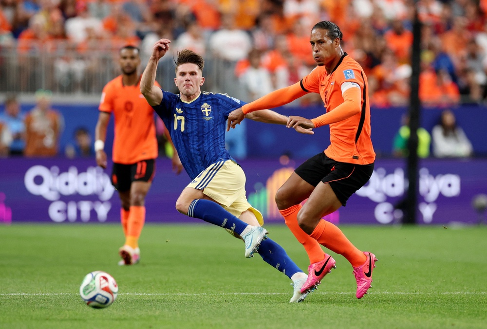 Viktor Gyokeres is challenged by Virgil van Dijk (Reuters)