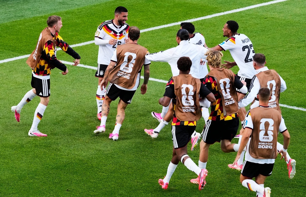 Germany's Deniz Undav (26) is mobbed by teammates (AP)