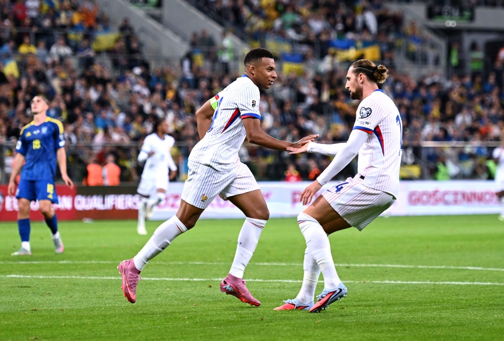 Kylian Mbappe of France celebrates scoring against Ukraine with teammate Adrien Rabiot (Getty)