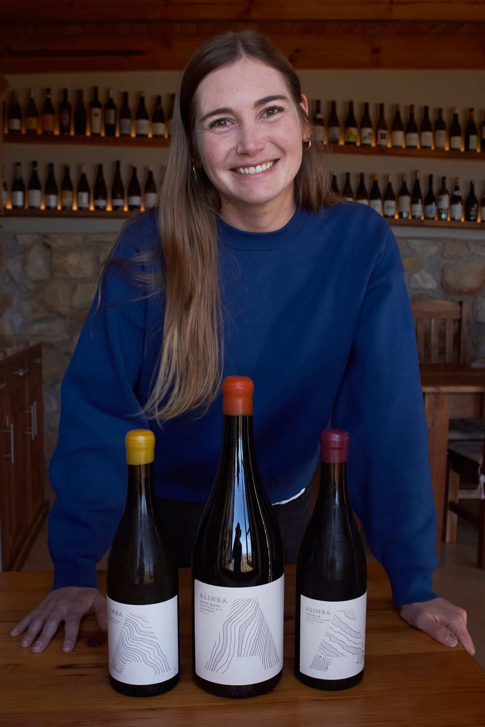 Natasha Jacka stands with some of her wines in Cape Town (Copyright 2026 The Associated Press. All rights reserved.)