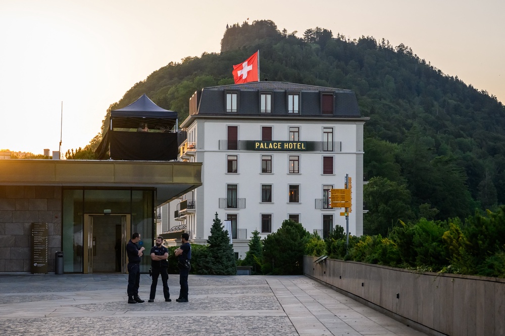 Police officers stand next to a building at the Burgenstock luxury hotel complex overlooking Lake Lucerne in Switzerland where peace talks are set to begin shortly (AFP/Getty)