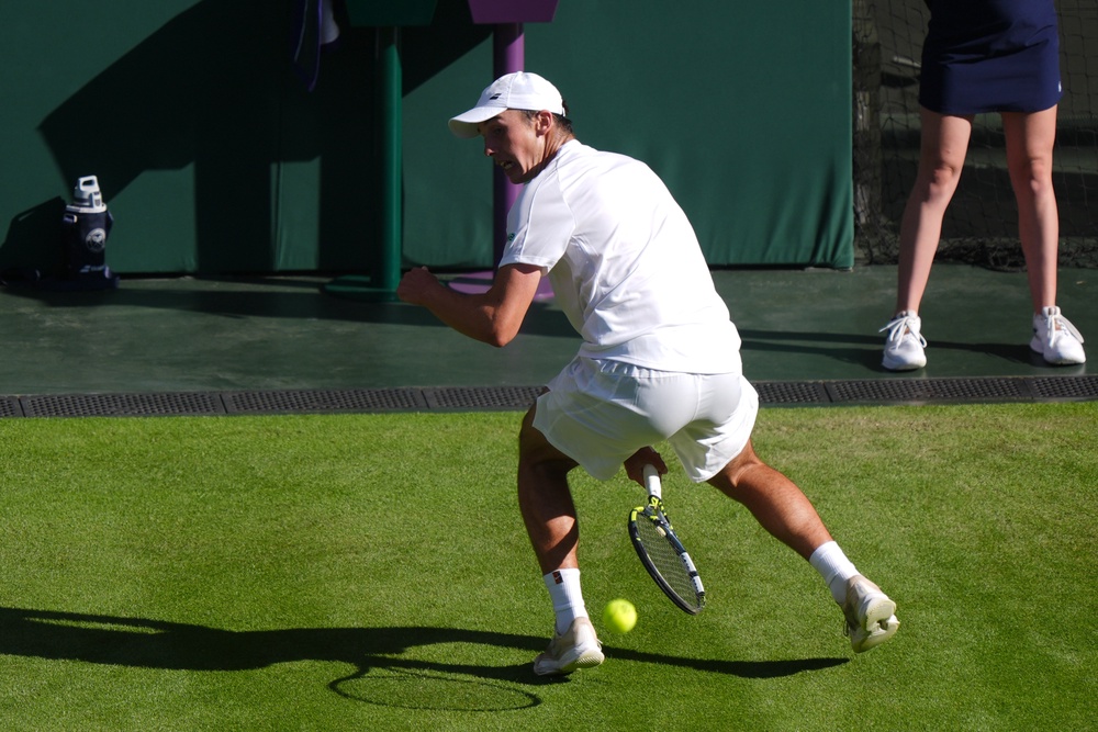 Oliver Tarvet plays a tweener at Wimbledon (Ben Whitley/PA) (PA Archive)