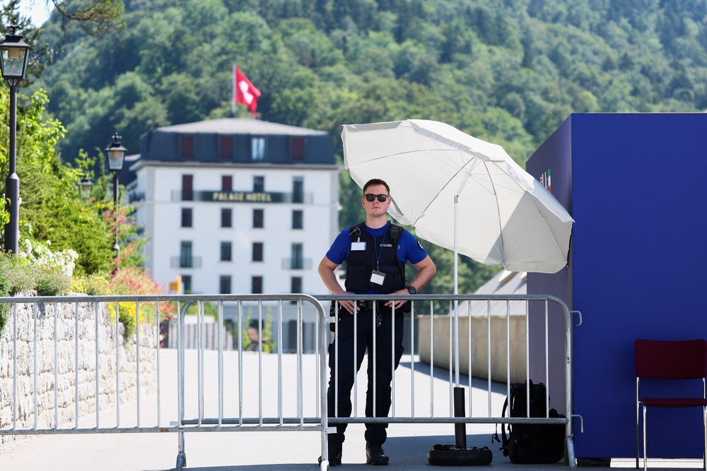 A police officer stands guard at one of the entrance to the Buergenstock Resort, on the day of US-Iran talks, in Stansstad, Switzerland, June 21, 2026 (Reuters)