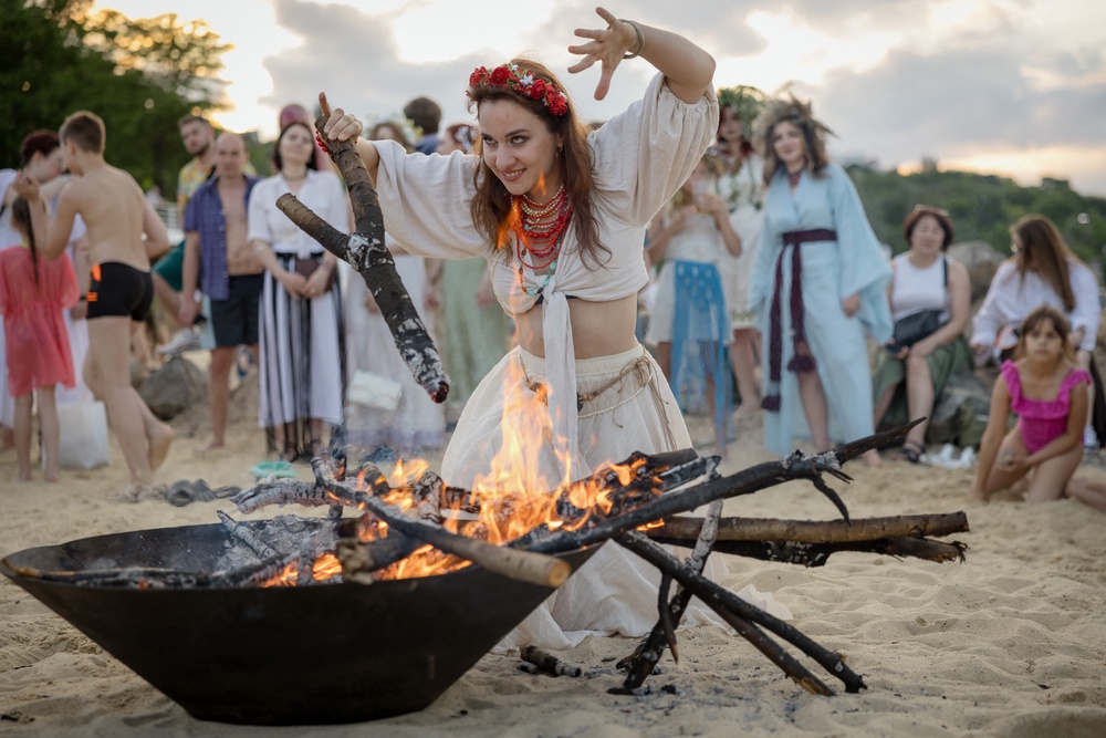 A woman dances next to a bonfire as people celebrate Ivan Kupala, a traditional holiday associated with the summer solstice that has been observed in Ukraine since pre-Christian times (AFP/Getty)