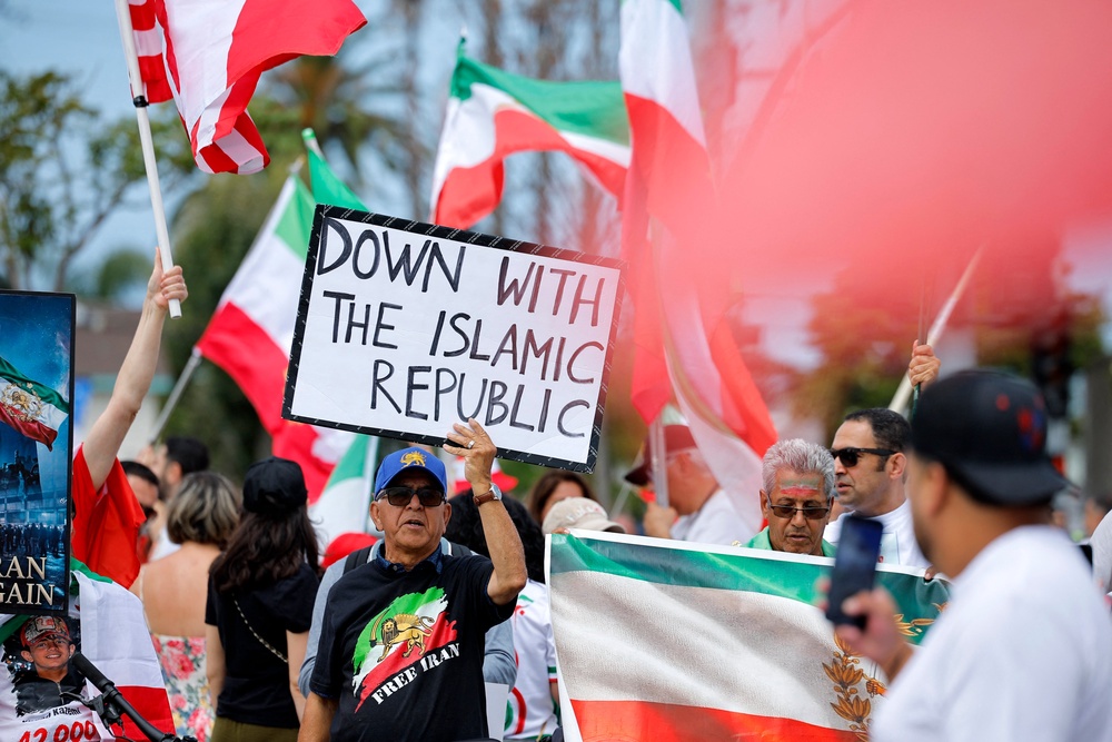 Iranian-Americans protest outside the stadium before the match (Reuters)