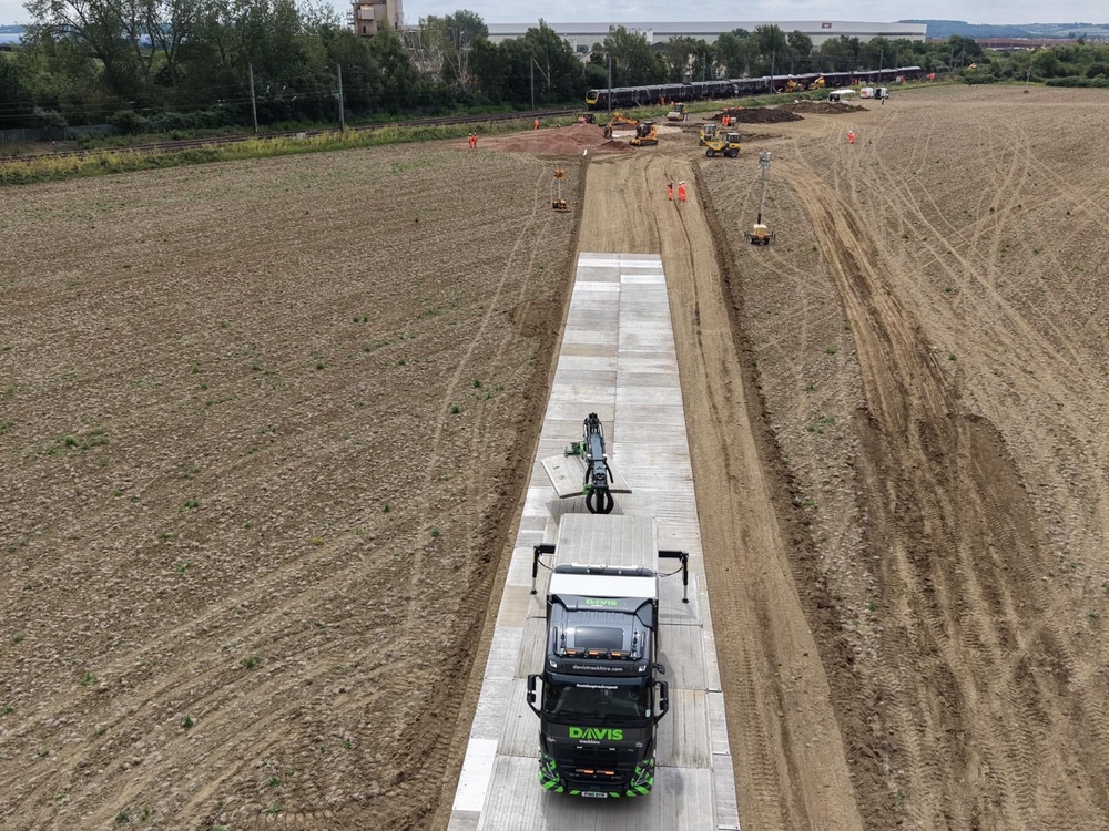 Crews are building a temporary road so when the carriages are taken off the track they can be driven away (Network Rail/PA)