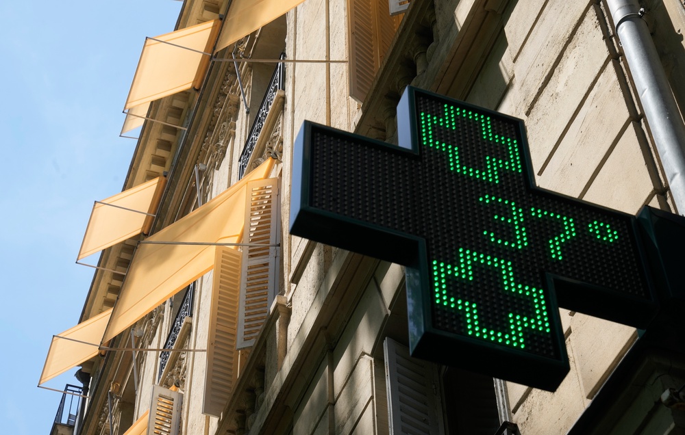 A sign outside a pharmacy displays a temperature of 37C in Paris (Michel Euler/AP)
