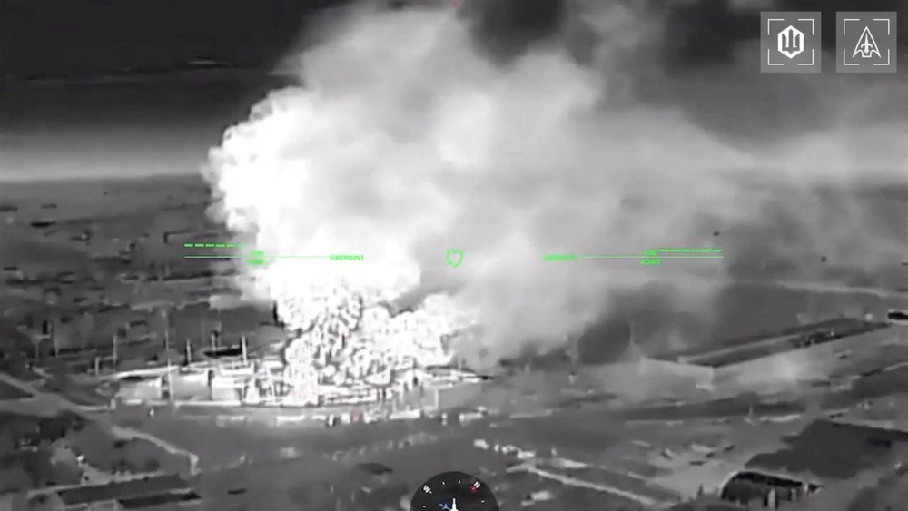 A drone footage shows fire and smoke rising from buildings, in what Ukrainian president Volodymyr Zelensky said was an attack on an oil depot in the city of Kerch (Reuters)