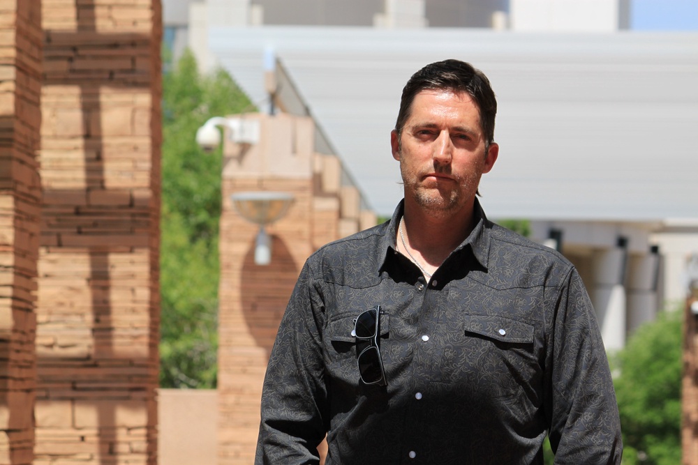 DEA Special Agent David Howell, who filed a whistleblower complaint, poses for a portrait outside the U.S. district courthouse in Albuquerque (Copyright 2026 The Associated Press. All rights reserved.)