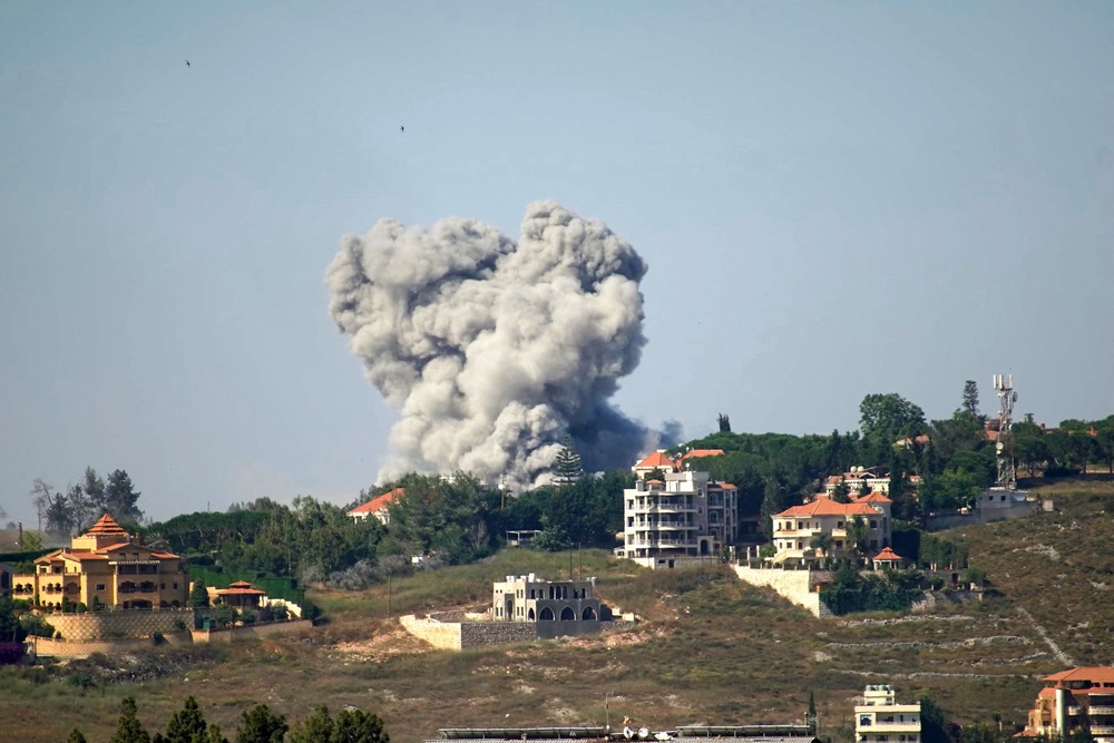 Israel has continued to attack Hezbollah in Lebanon, drawing fury from Iran (Natabieh pictured on Saturday) (AFP/Getty)