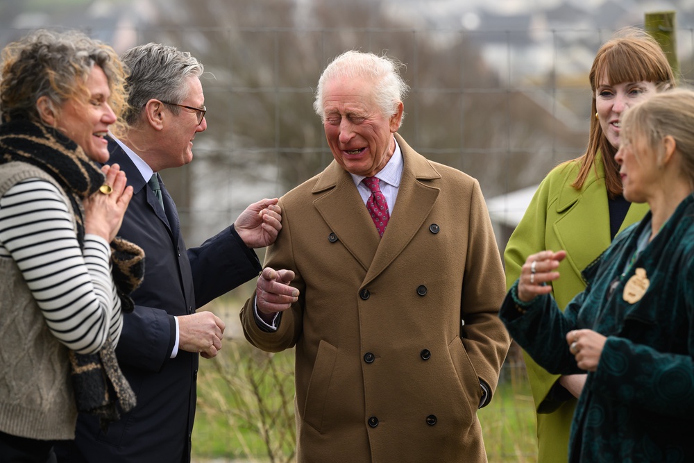 The King laughs as he chats to Sir Keir during a visit to Newquay Orchard in Cornwall (Leon Neal/PA) (PA Archive)