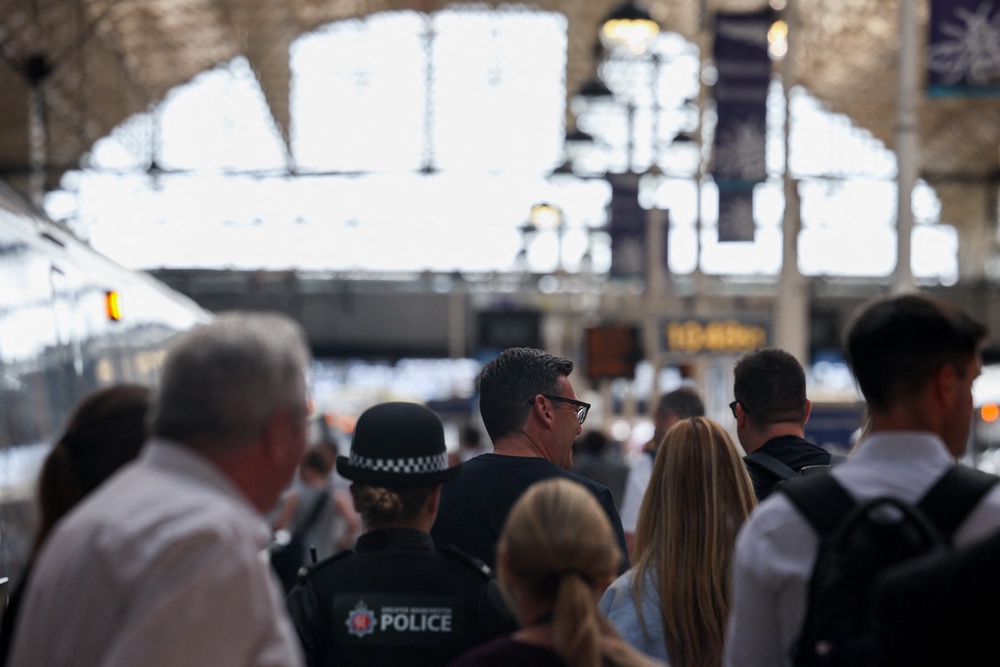 Newly elected Makerfield MP Andy Burnham at Manchester Piccadilly station as he leaves for London (Reuters)