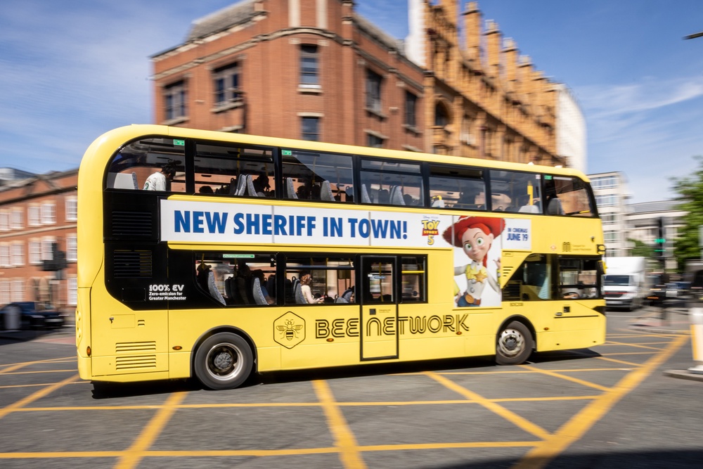 A Bee Network bus in Manchester city centre: bringing buses into public control was a flagship Burnham policy (PA)