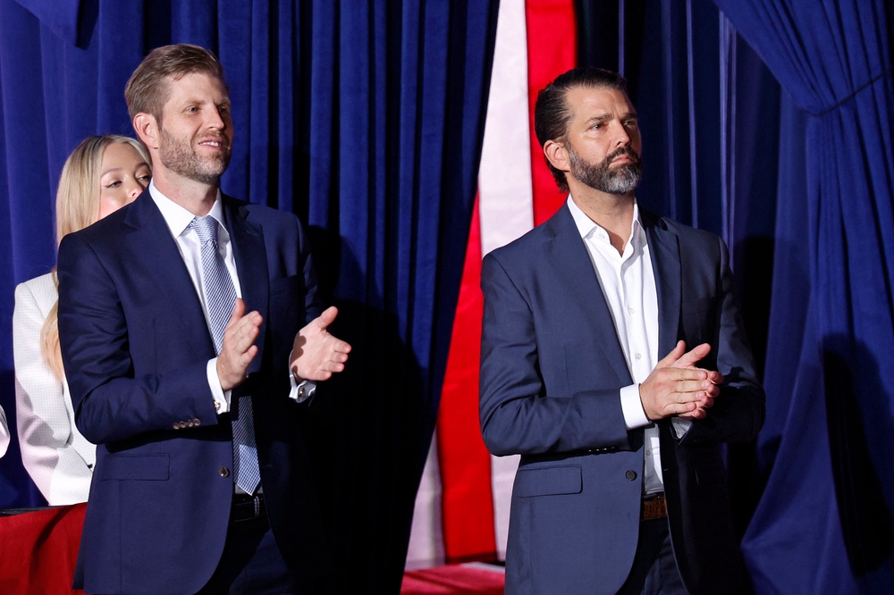 Donald Trump Jr (right) handles his father’s revocable trust, which holds the president’s portfolio, in addition to other business ventures outside of the Trump Organization (AFP/Getty)