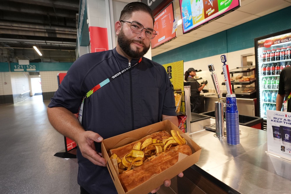 Lazaro Luya, the concession chef at Sol Cubano, displays their special, pan with lechon and fresh mariquitas at Miami Stadium Sunday, June 21, 2026, in Miami Gardens, Fla. (AP)