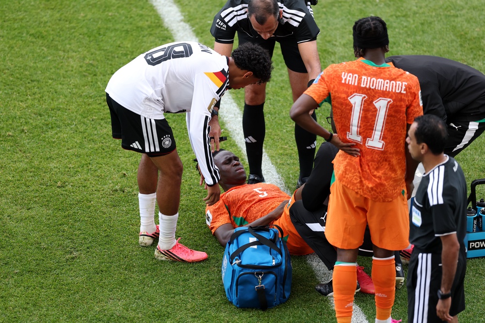 Wilfried Singo receives treatment against Germany (Getty)