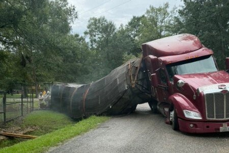 Emergency officials in Orange County promptly closed roads Sunday morning, advising residents to remain indoors (Christie Ray/Queen Bee Supply via AP)