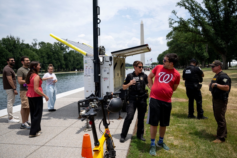 A man is arrested after shouting at police patrolling the Lincoln Memorial Reflecting Pool on Monday. The scene has become a fixture for D.C. residents (AFP/Getty)