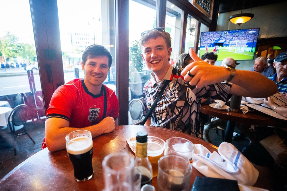 England fans pose for a photo in the Dubliner Pub in Boston. Ahead of England's game against Ghana on Tuesday in the FIFA World Cup 2026. Picture date: Sunday June 21, 2026. PA Photo. Photo credit should read: James Manning/PA Wire. (James Manning/PA Wire)