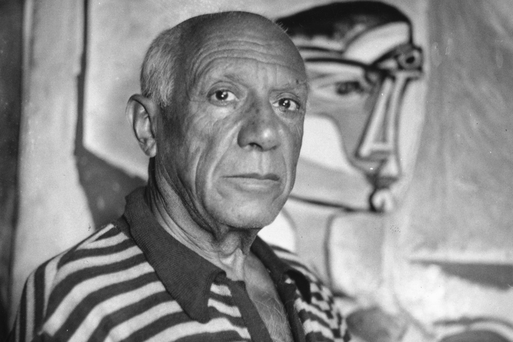 Picasso, who died in 1973, pictured with one of his paintings at his home in Cannes (Getty)
