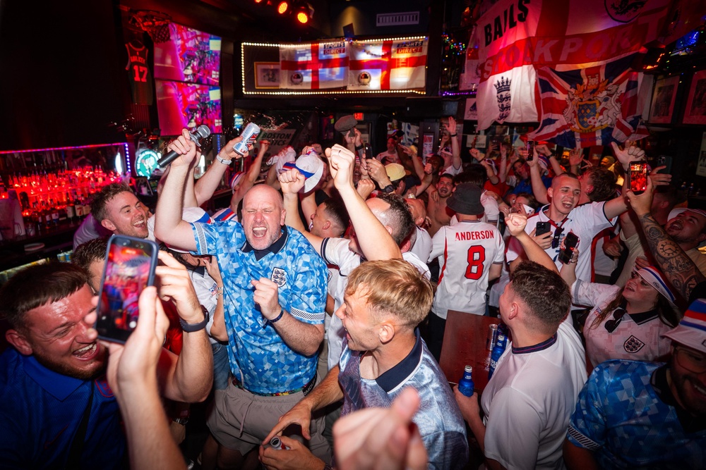 Chris McClure, who is also known as Steve Bracknall, enjoys a night out with fellow England fans (James Manning/PA) (PA Wire)