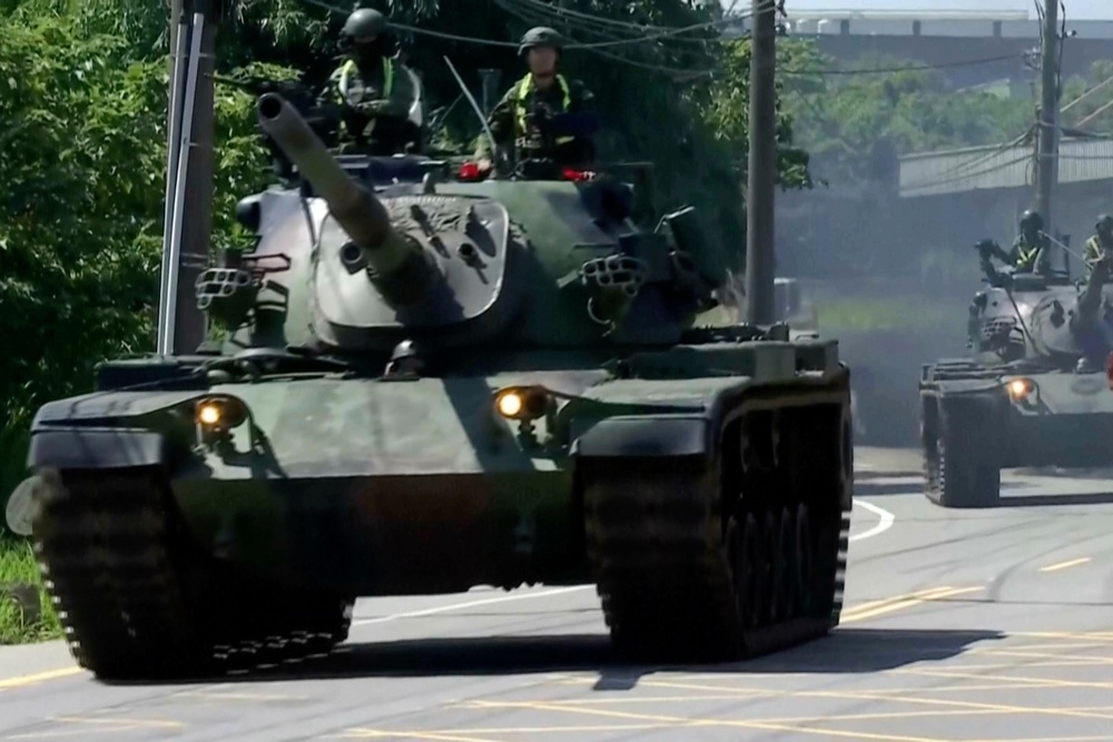 Tanks patrol a street during combat readiness exercises in Taoyuan, Taiwan, on 22 June 2026 (SET TV)