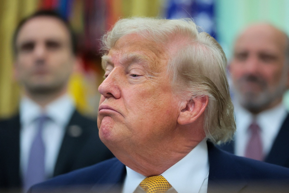 US president Donald Trump looks on as he speaks to reporters before signing two executive orders regarding quantum computing, in the Oval Office at the White House in Washington, D.C (Reuters)