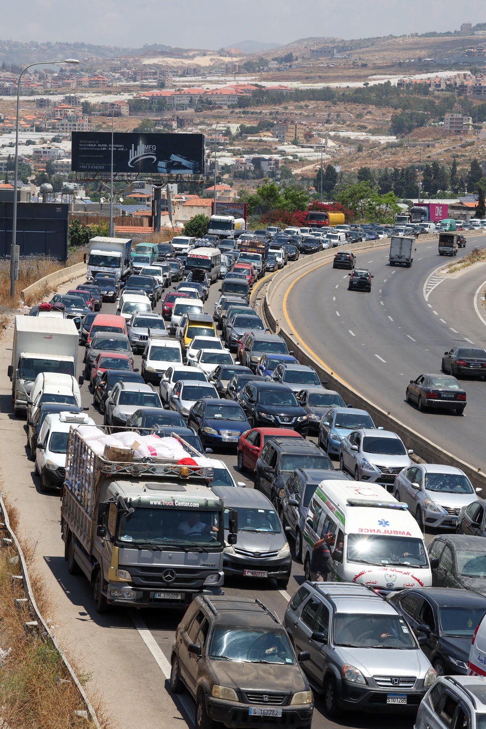 Displaced people make their way back to their homes in southern Lebanon following an interim deal between the U.S. and Iran, in Sidon (Reuters)