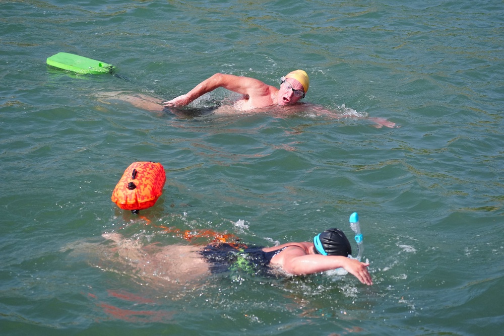Swimmers cool off as the temperature began to rise (Owen Humphreys/PA) (PA Wire)