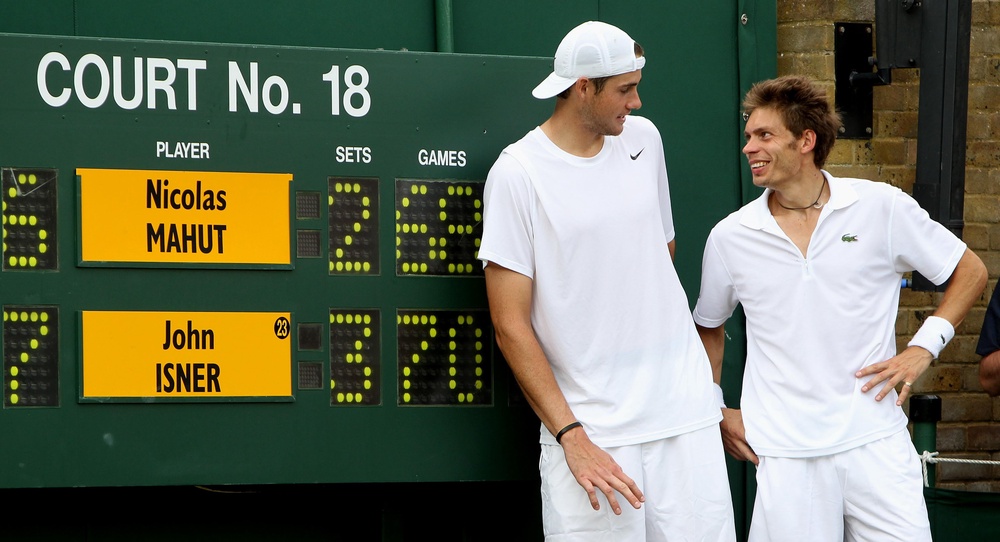 John Isner, left, and Nicolas Mahut stand next to their historic Wimbledon scoreboard (Alastair Grant/AP/POOL Wire) (PA Archive)