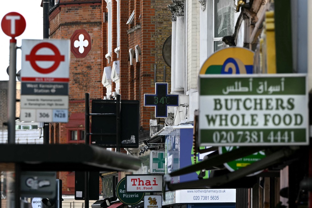 A sign outside of a pharmacy displays the temperature in west London, on June 23, 2026 (AFP/Getty)