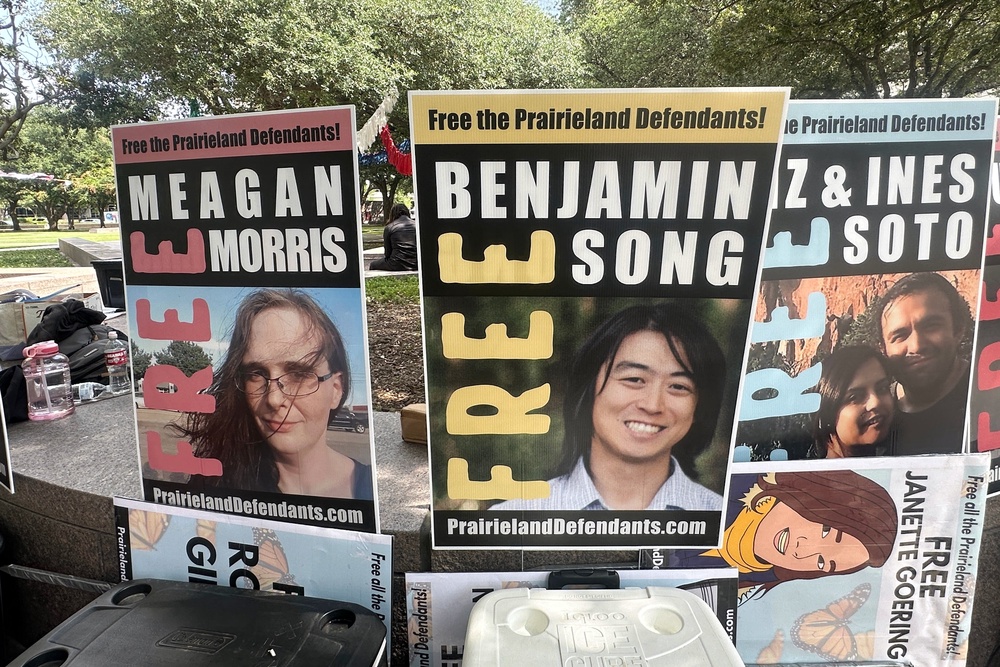 Supporters outside a federal courthouse in Fort Worth, Texas on June 23 protested decades-long prison sentences handed down against a group of protesters accused of planning a terror attack against an ICE detention center (AP)