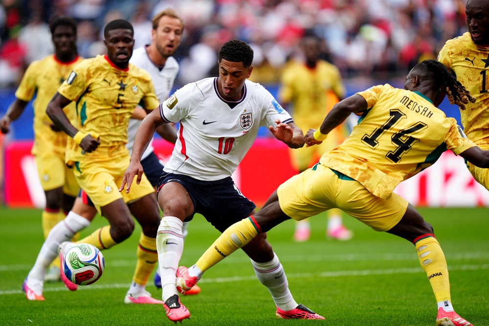 England's Jude Bellingham and Ghana's Gideon Mensah (right) battle for the ball (PA)